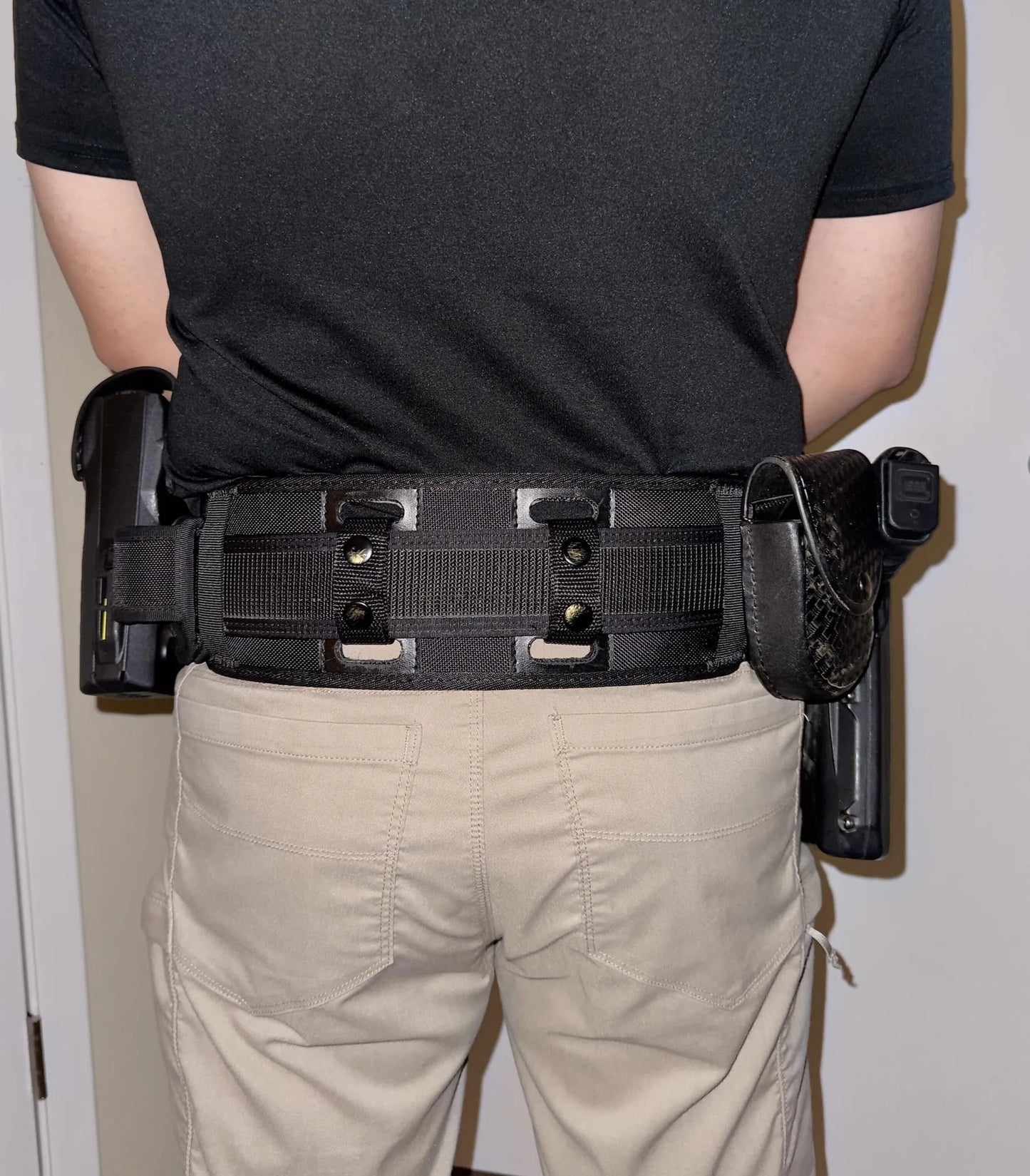 Officer photo showing backupbrace worn on duty belt